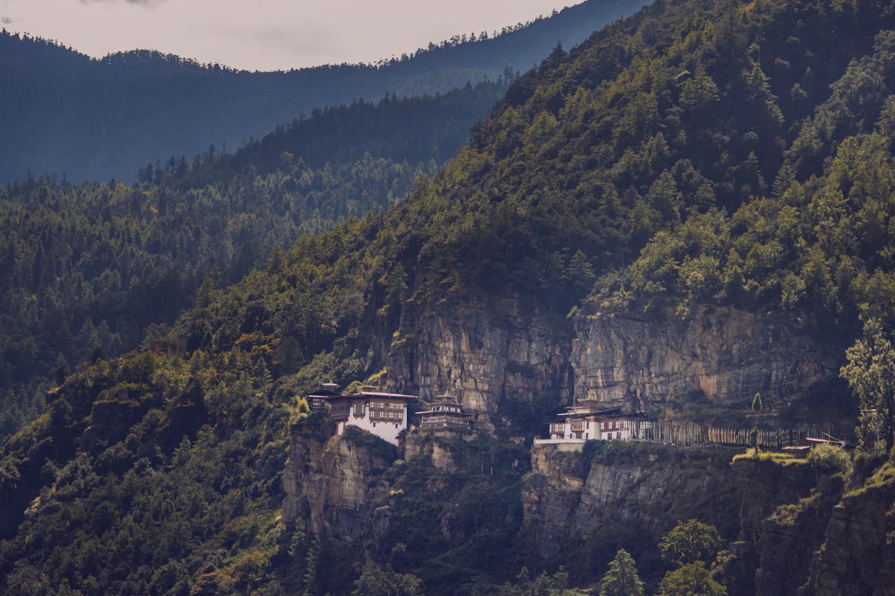 services-img The famous Tiger's Nest Monastery perched on a cliffside in Bhutan's lush mountains.